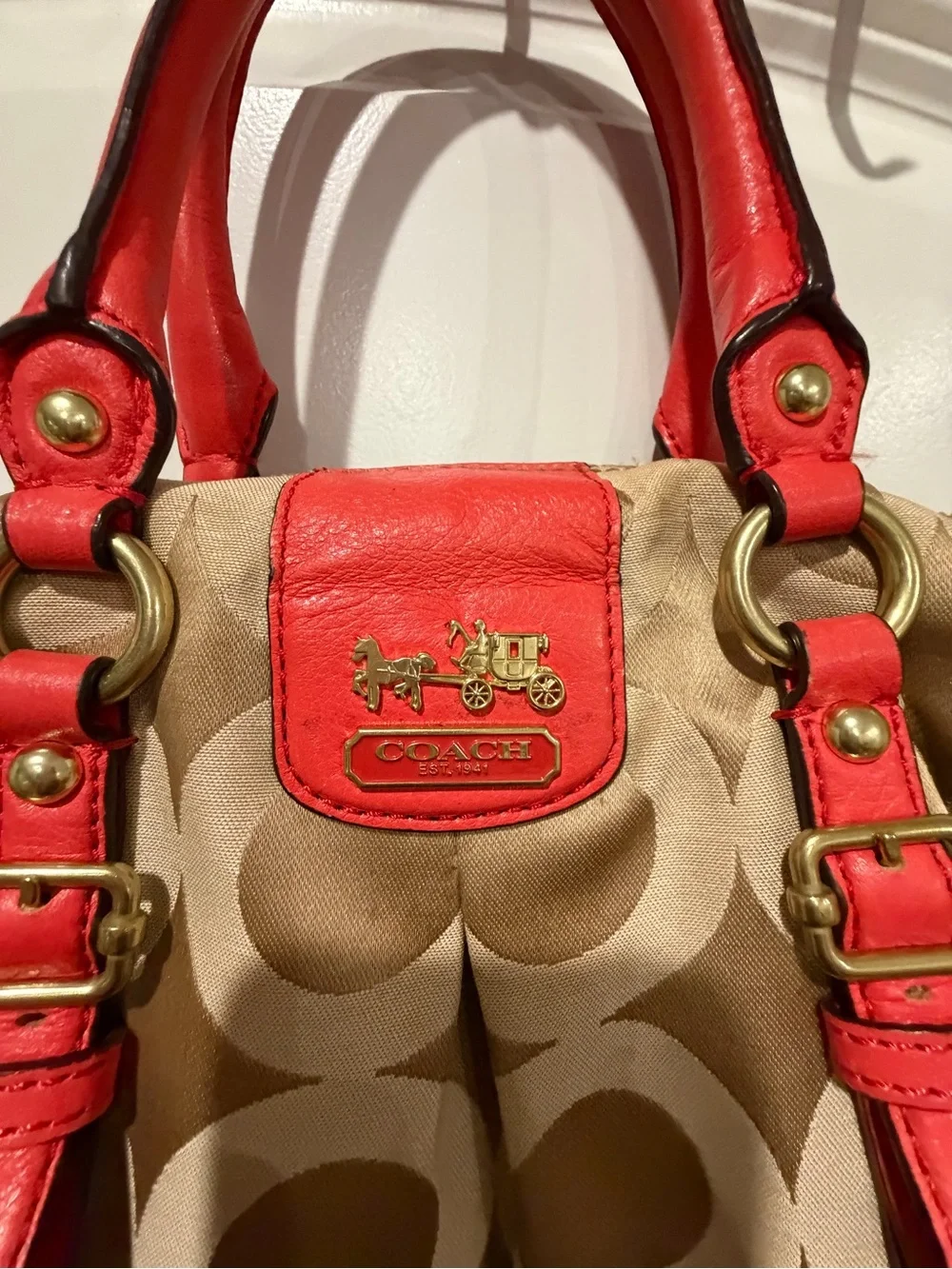 Coach Beige Signature Canvas Satchel with orange Trim and Handles. No strap